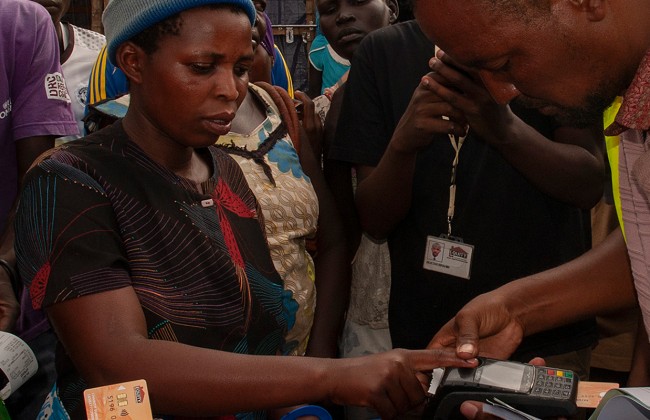 The distribution of cash-based assistance is verified using biometric data.